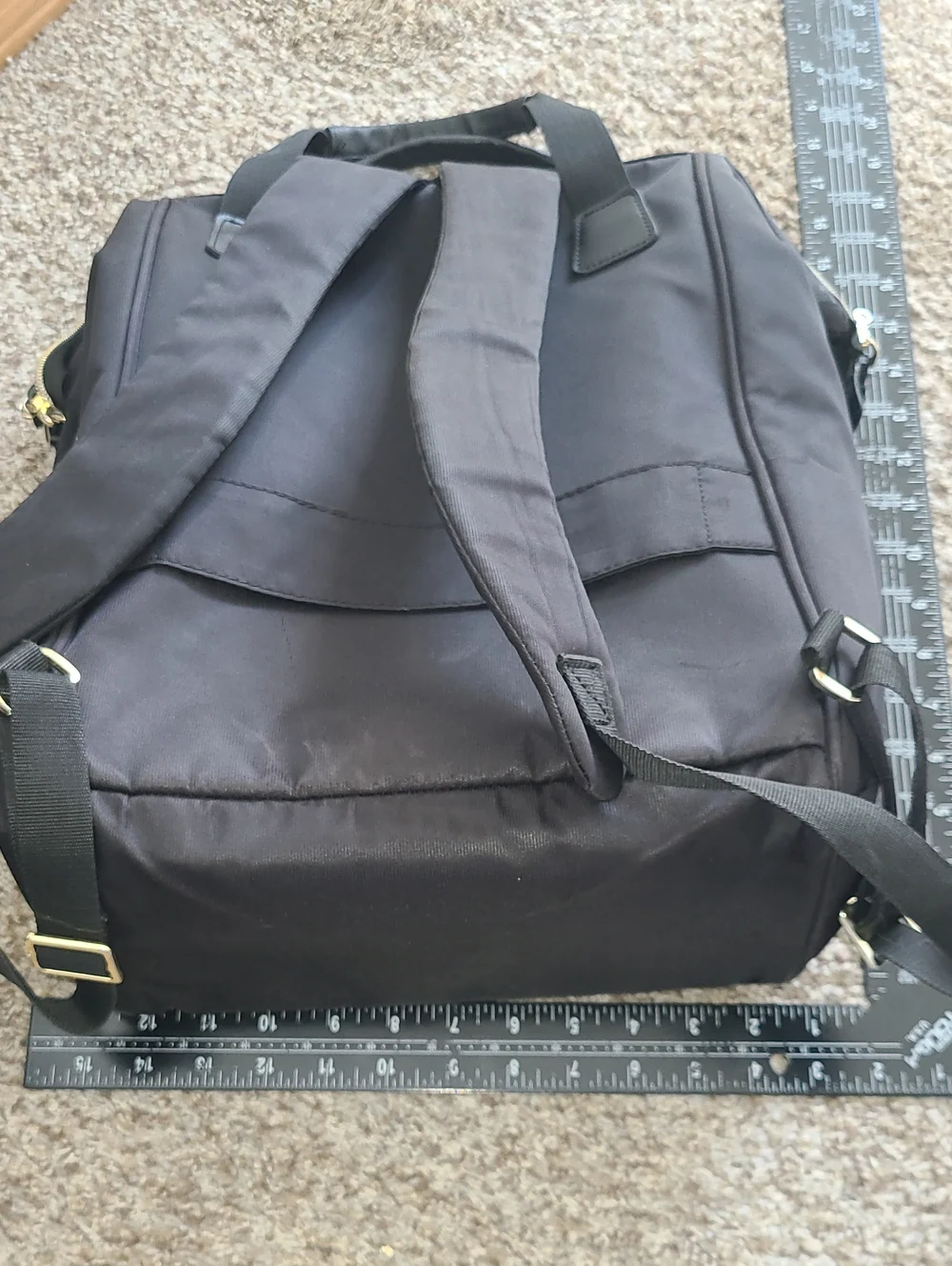 Delsey Paris Black Laptop Backpack with Gold Accent